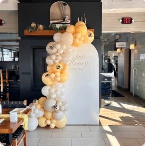 Warm yellow and ivory baby shower balloon garland