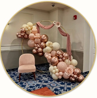 Blush, ivory and rose gold balloon arch with pink drapery