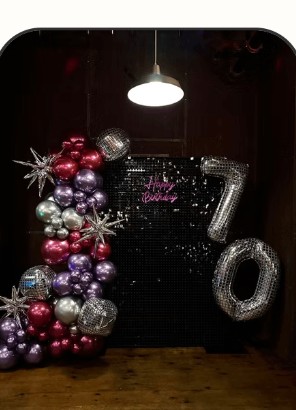 Elegant dark maroon and silver 70th birthday backdrop