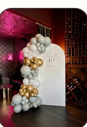 Gold, silver and white balloon arch for a 40th birthday