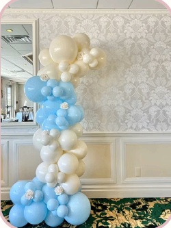Ivory and light blue balloon column in a formal event room